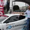 GPSTrackIt.com National Account Executive Scott Siegfreid with a Zero Emissions Nissan Leaf at the 2013 AltCar Expo.