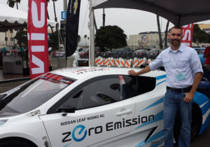 GPS Trackit National Account Executive Scott Siegfreid with a Zero Emissions Nissan Leaf at the 2013 AltCar Expo.